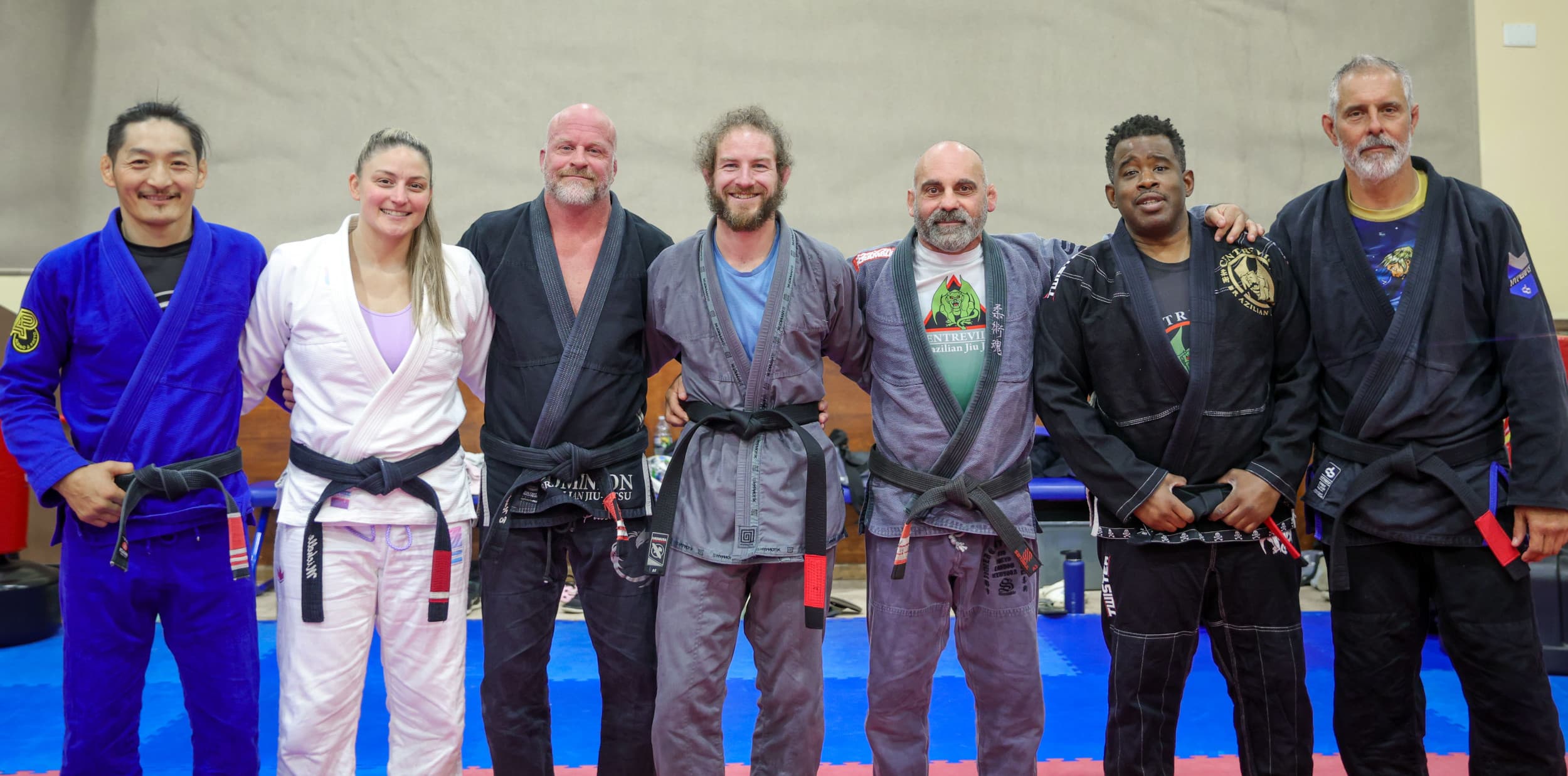 Robbie surrounded by fellow black belts soon after being promoted himself.